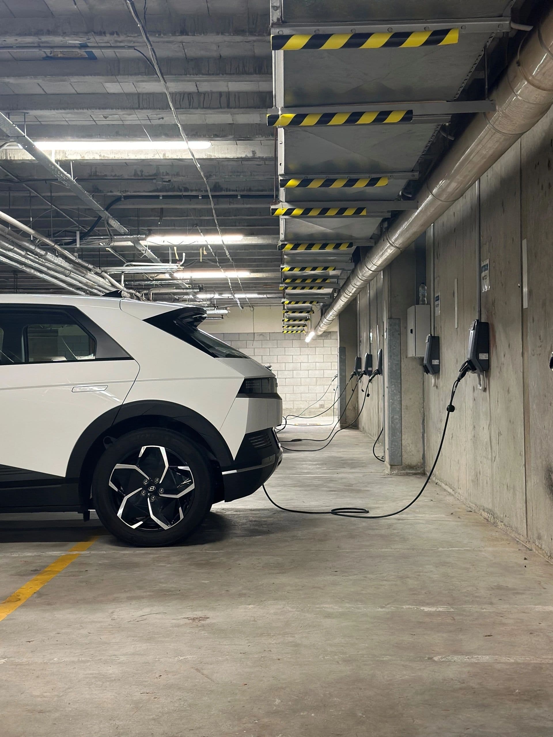 Managed EV charging bays in an apartment basement car park