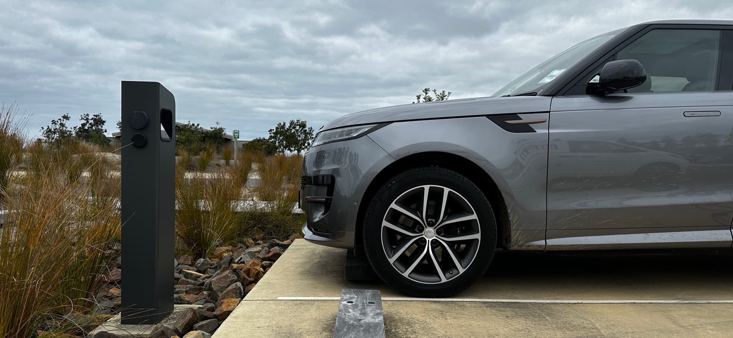 SUV parked at a public bollard EV charger installed by Tronic Electrical