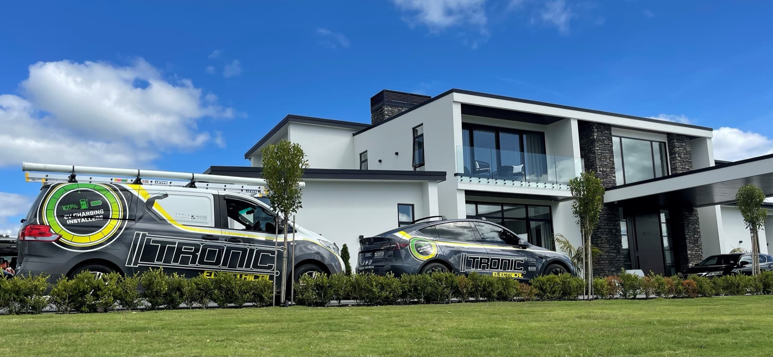 Tronic Electrical vehicles outside a modern Auckland home